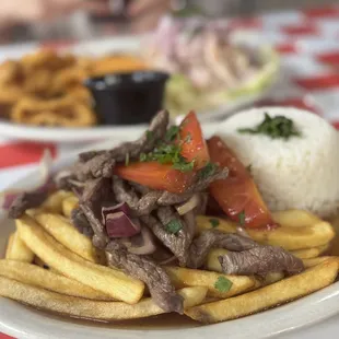 a plate of steak and fries