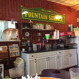 a counter with a sign above it