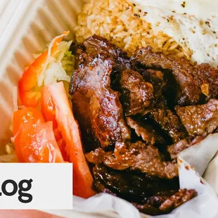 a close up of a sandwich in a styrofoam container