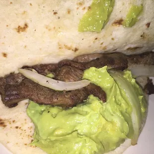 hows a steak burrito with guacamole and onions