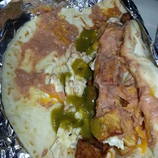 I took a papa con bacon taco and added cheese, egg and refried beans