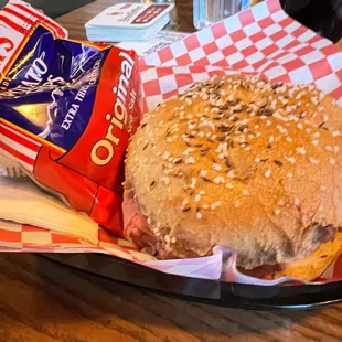 a hamburger and chips in a basket