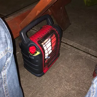 a red and black portable heater