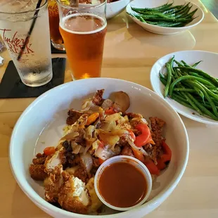Chick &apos;n&apos; Grits
 
 Crispy chicken tossed with red onion, roasted red peppers and Nashville hot sauce. Served over hatch pepper cheesy grits.