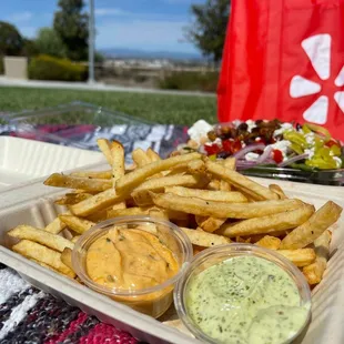 a tray of fries and dips