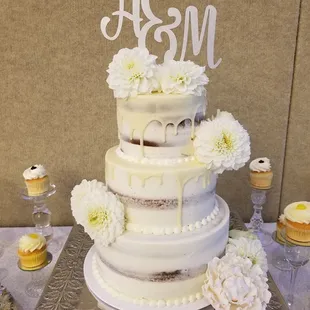 Don&apos;t like frosting all that much? Get a naked cake with a white chocolate ganache drip for your wedding cake.