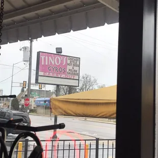 a bicycle leaning against a fence
