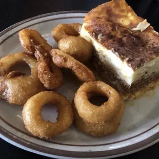 Huge portion of great Pastitio and crunchy good onion rings as one of the 2 sides that are included.