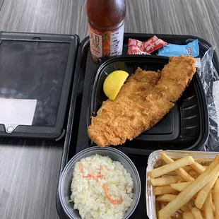Fried haddock fries and coleslaw.