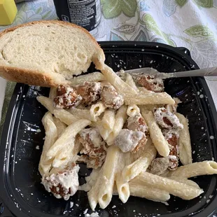 Penne alfredo with Parmesan chicken. This was after I ate half and remembered to take a picture! Small size bowl.