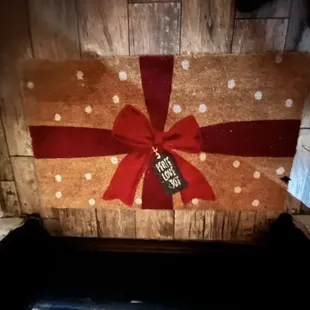 a gift wrapped in a red ribbon