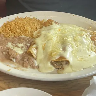 Sour Cream Chicken Enchiladas with Rice and Beans (comes with two, we added a third because this is one of our favorites!)