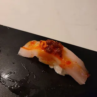 Must've missed this one in my notes, but it does appear to be yellowtail nigiri with some satay or chili crisps.