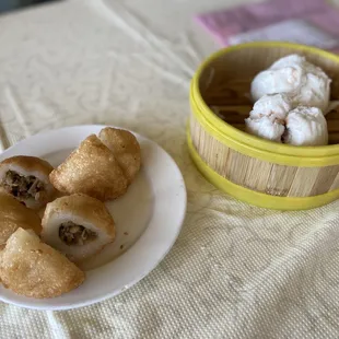 a bowl of ice cream and a plate of food