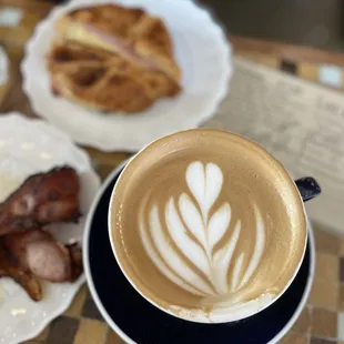 a cup of cappuccino and bacon