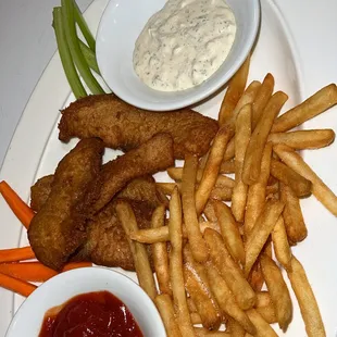 a plate of french fries, carrots, and dip