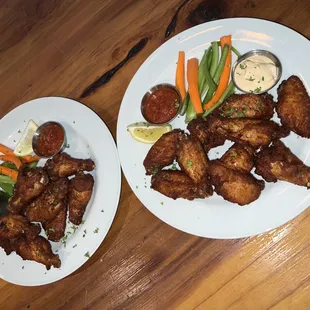 two plates of food on a wooden table