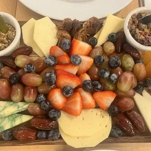 Beautiful AND delicious cheese charcuterie board with a side of bread $20