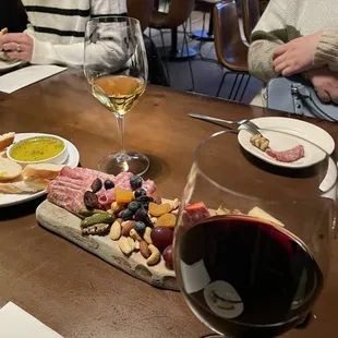 people sitting at a table with wine glasses