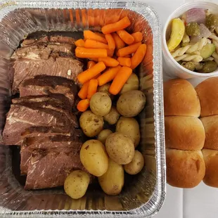 meat, potatoes, carrots, and bread