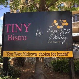 a sign for tiny bistro