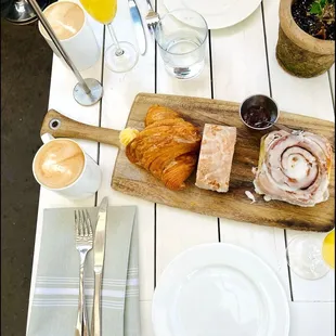 Croissant, cinnamon bun, mimosas