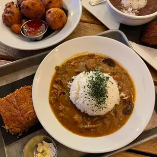 Hush puppies, jambalaya, gumbo...so good! Got a po&apos; boy too, not pictured but equally delicious, as were the fries.