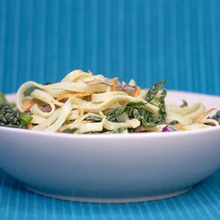 a bowl of noodles and broccoli