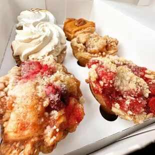 a variety of pastries in a box
