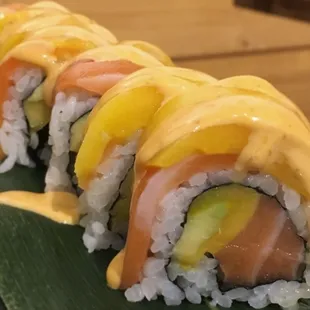 Mango Salmon Roll
Fresh Mango, Salmon, Avocado Topped with Salmon,  Fresh Mango,  Mango Sauce &amp; Cramy Mayo.