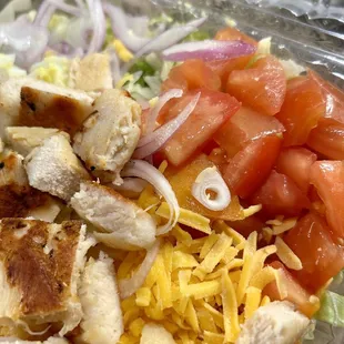 a salad in a plastic container