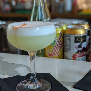 a drink in a glass on a table