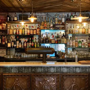 a bar with lots of bottles