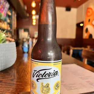 a bottle of beer on a table