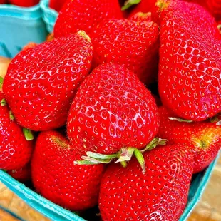 strawberries in a blue container