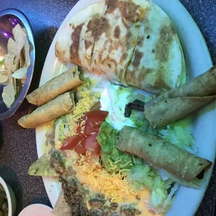 Chicken quesadilla, beef flautas &amp; ground beef nachos for the 3 item sampler