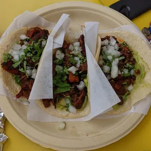 Al pastor tacos on corn tortilla.