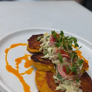 Tortillas de choclo (corn fritters, topped with crab salad)  Best thing we had