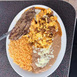 Chorizo and egg, steak, rice, and beans