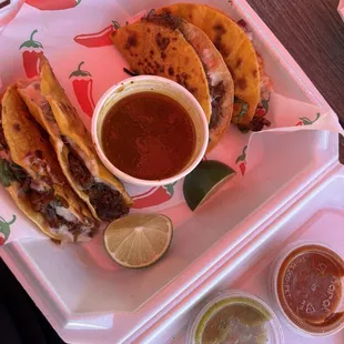 Cheesy birria tacos with consume