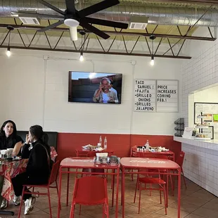 two women sitting at a table in a restaurant