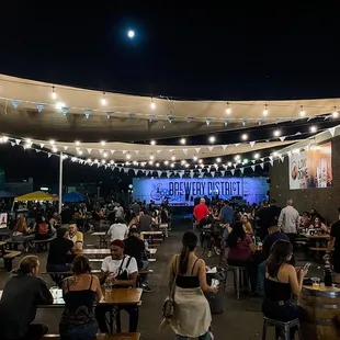 Hangout under the outdoor string lights at night with great beer and even great friends!