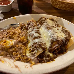 3 Bee shredded beef enchiladas, rice and beans.