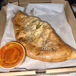 Cheese Calzone with Chicken, Peppers, Black Olives, Mushrooms