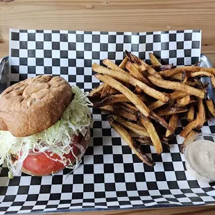 All American burger with a sour of small fries.