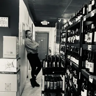 a man leaning against a wall