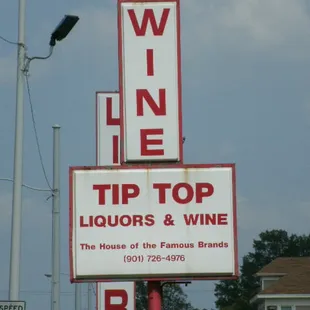 a sign for tip top liquors and wine