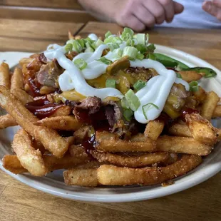 a plate of french fries with ketchup