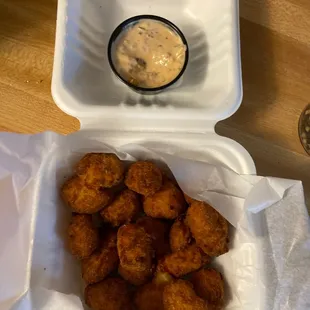 Cheese curds with spicy tip top house sauce.