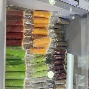 a refrigerator full of frozen fruits and vegetables